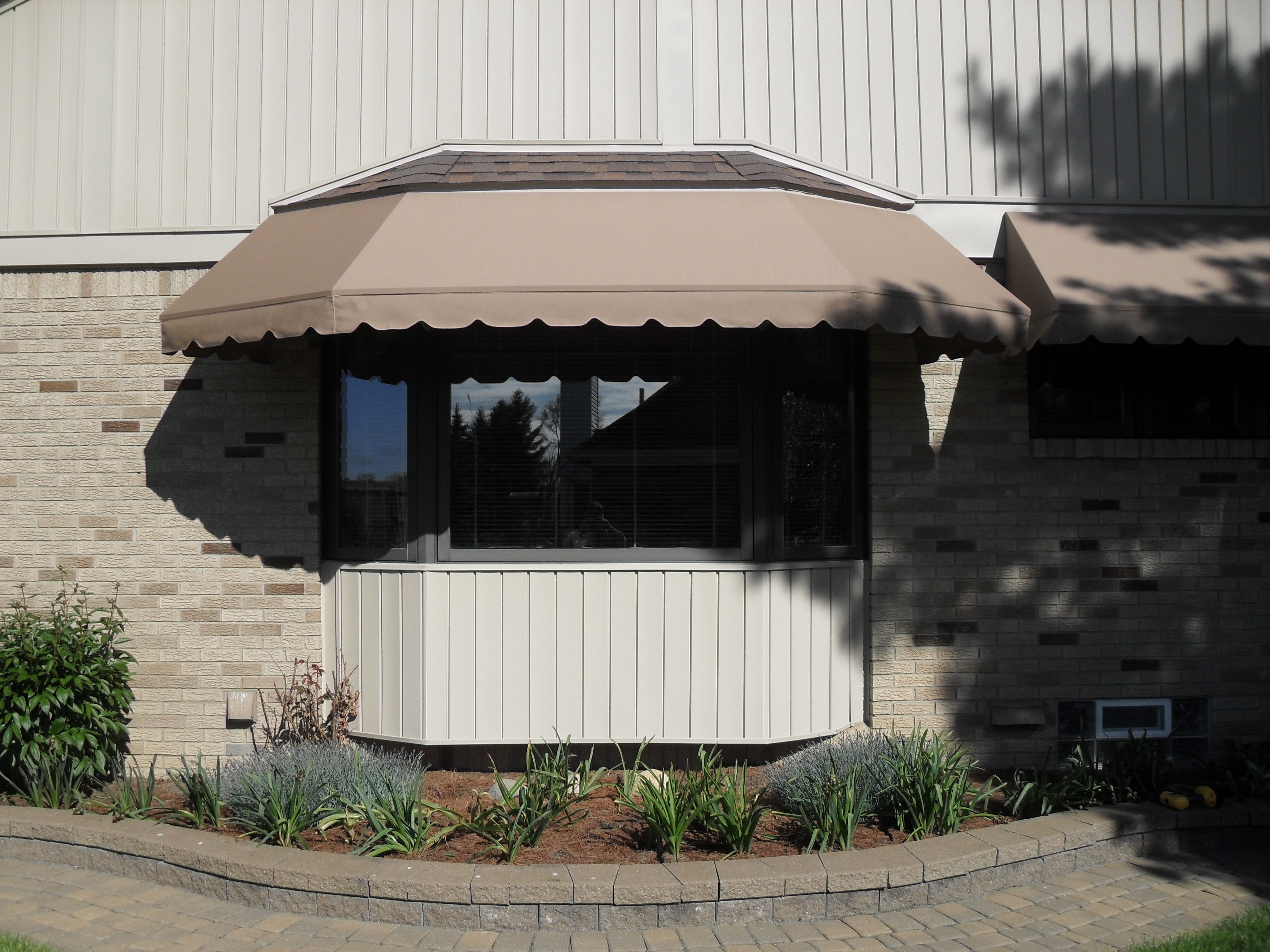 Image of a residential backyard patio with awning